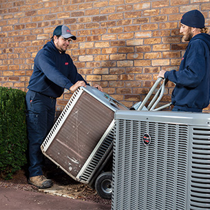 Aero Energy technicians remove old AC unit.