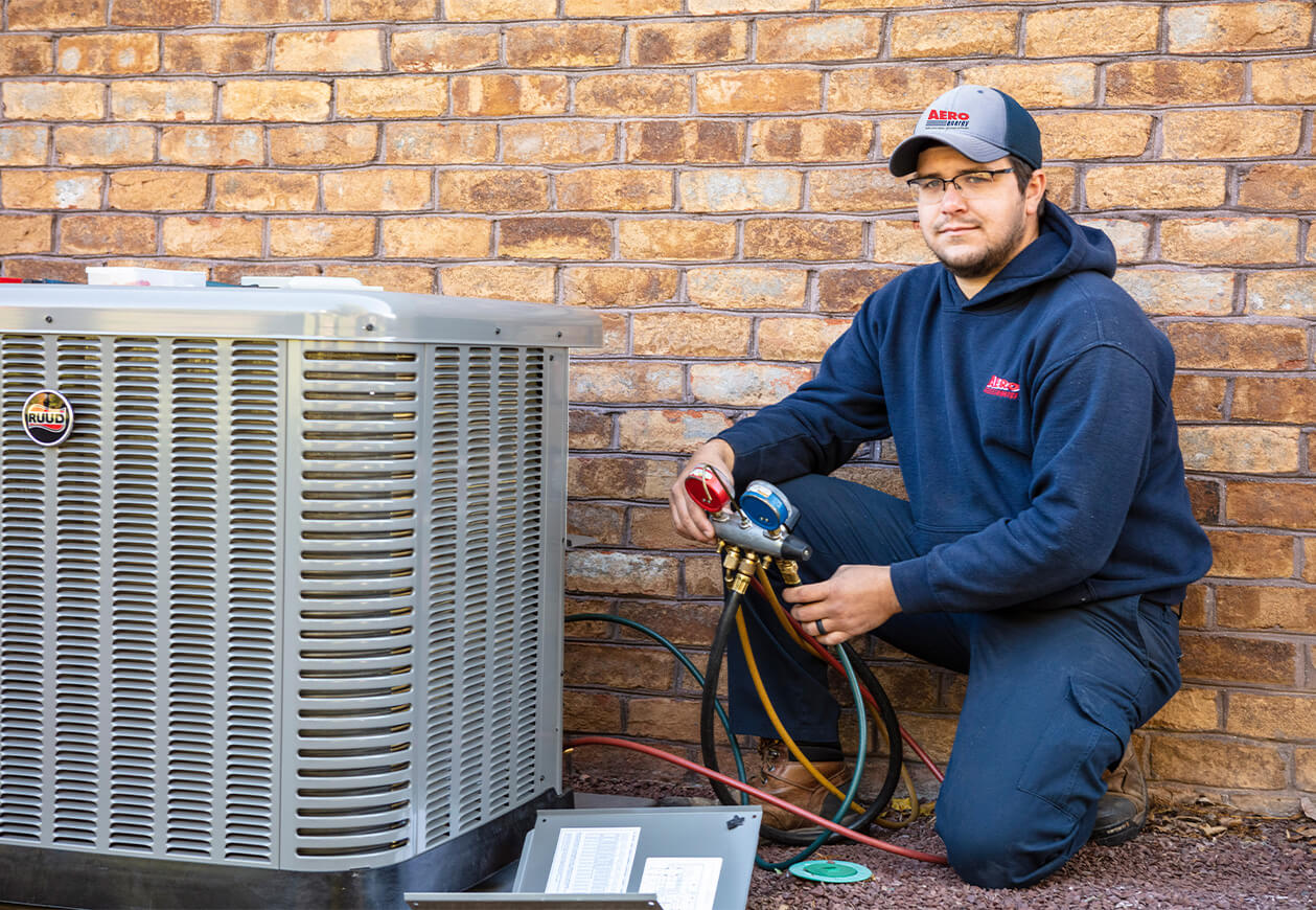 Aero Energy technician tests AC unit.