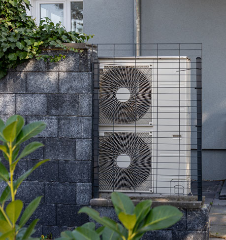 Air source heat pumps installed on the garden front