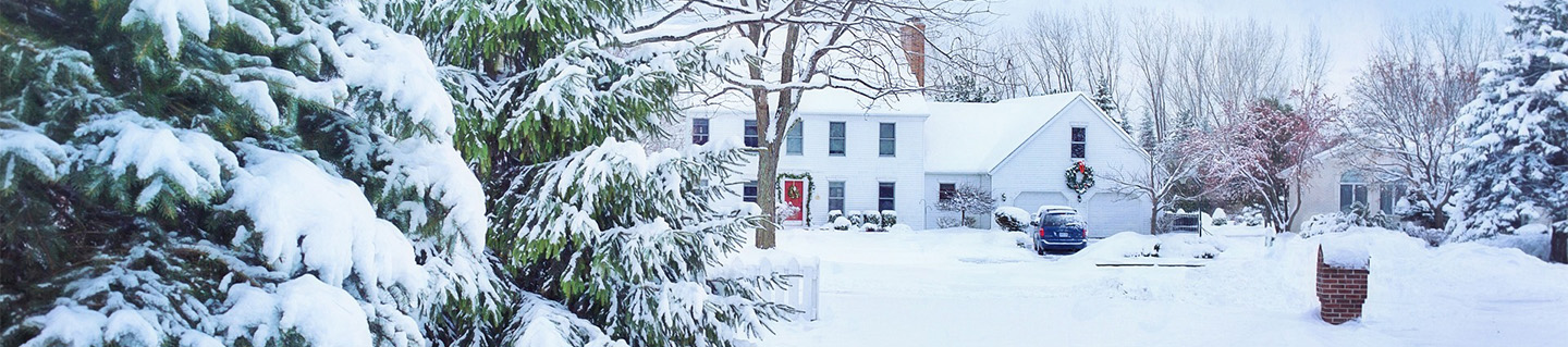 Home sits covered in snow after winter storm.