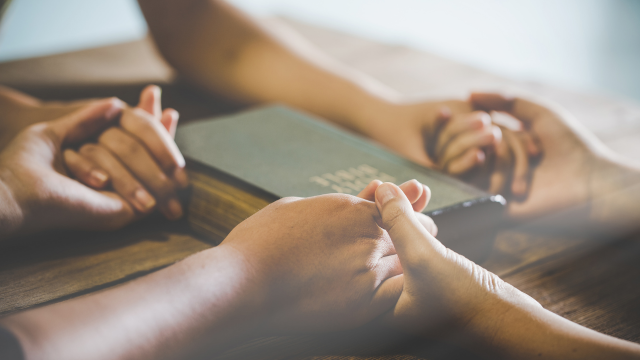 People pray together.