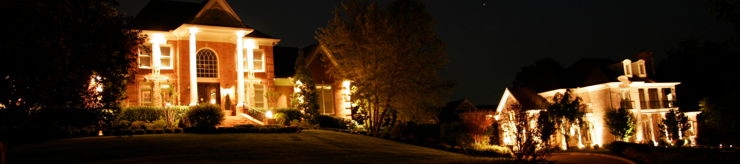 A house is lit up at night.