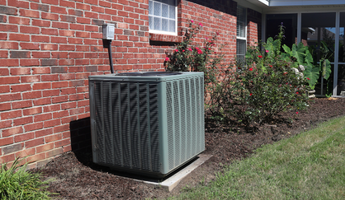 Is your HVAC system costing you? Old system sits next to a house.