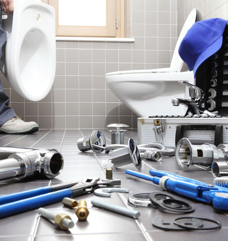 plumber at work in a bathroom